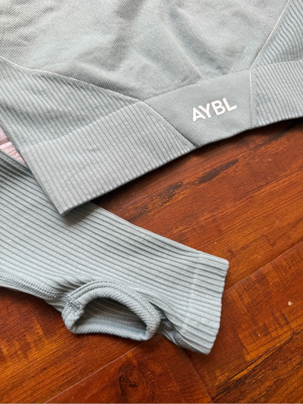 AYBL Balance V2 Seamless Long Sleeve Crop Top in a sage green color. Size small
